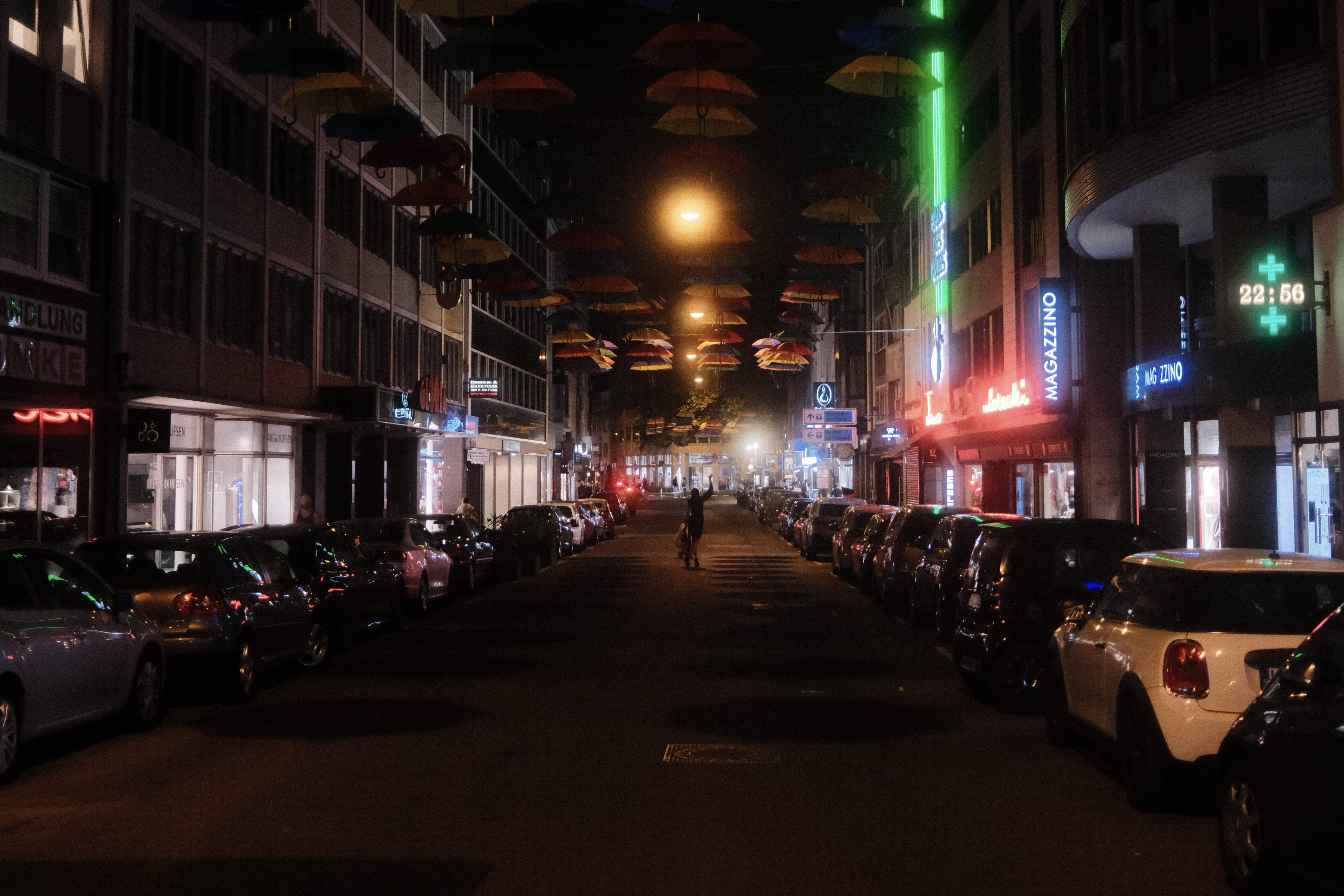 Night street with umbrellas